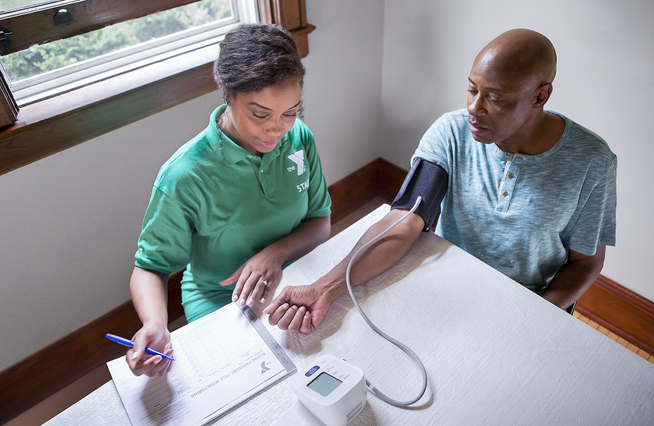 Doctor doing diabetes screening on patient