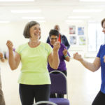 Group of senior women together in a cardio dance class
