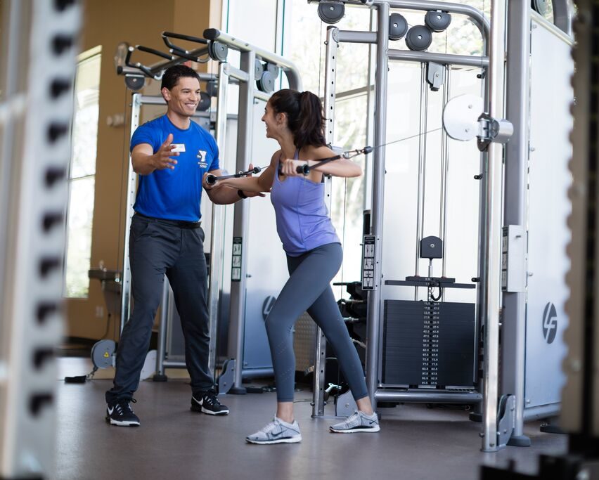 YMCA Trainer Working Out with a Member