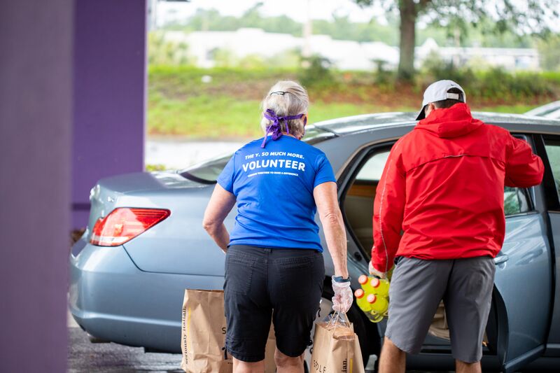 Volunteers Loading Cars at Food Distribution Event at Oviedo YMCA