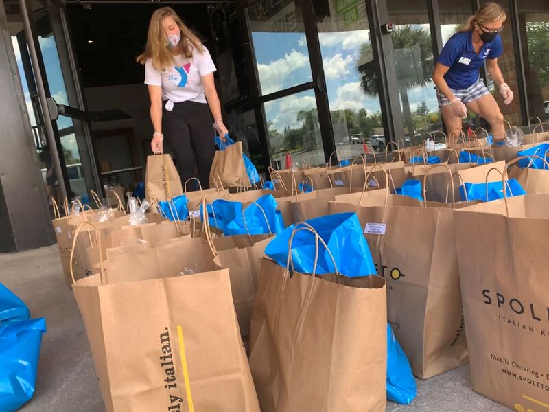 Volunteers Prepping Food Bags at Food Distribution Event at Titusville YMCA
