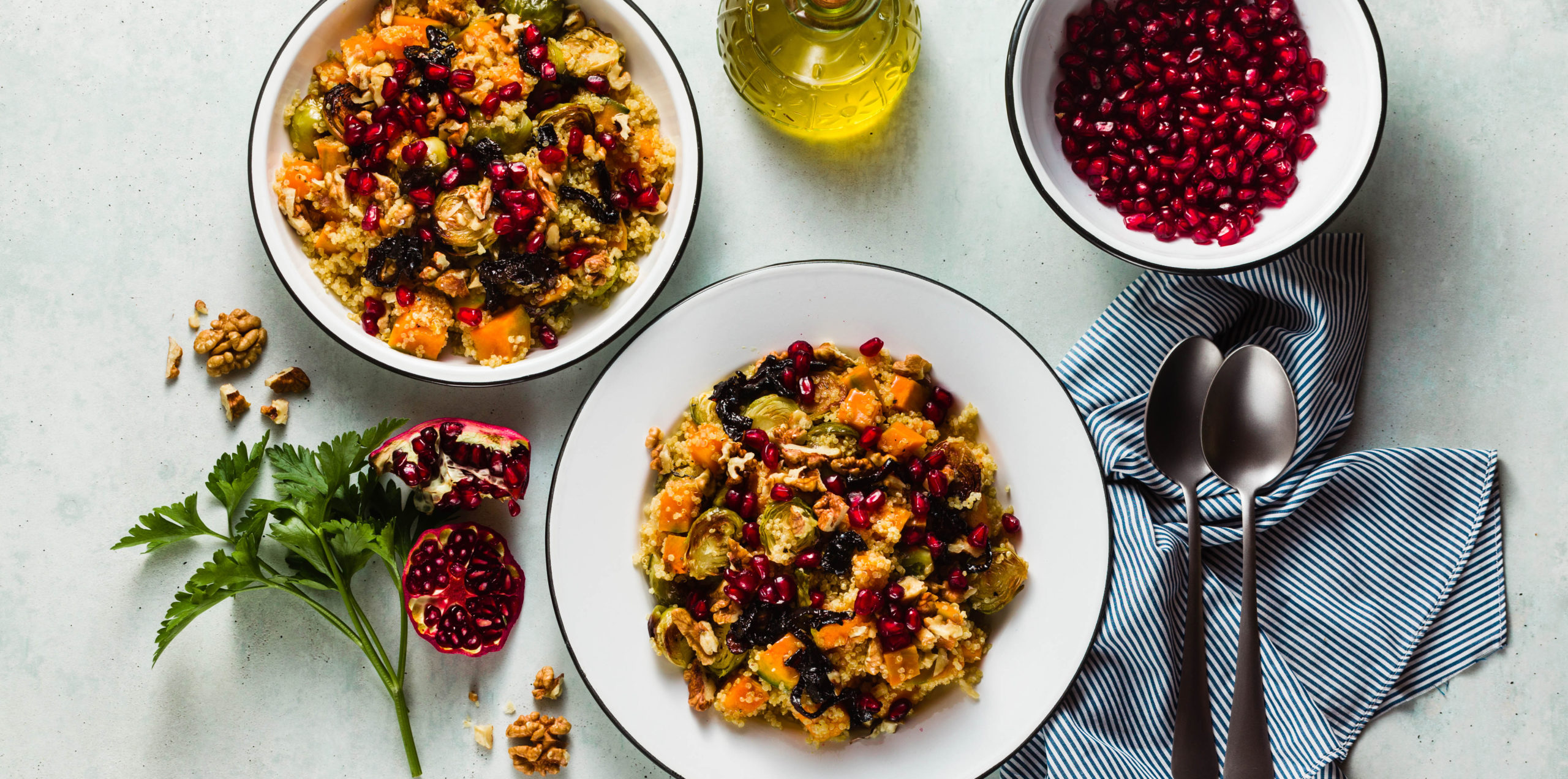 Roasted Brussel sprout salads in two white bowls