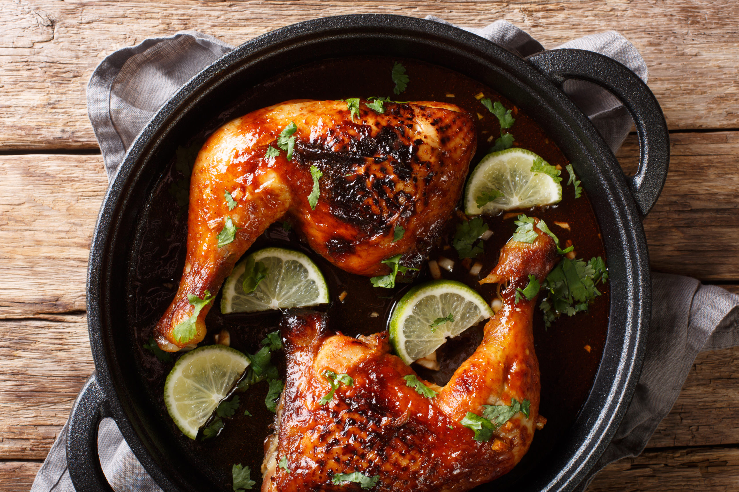 Baked chicken quarters with lime
