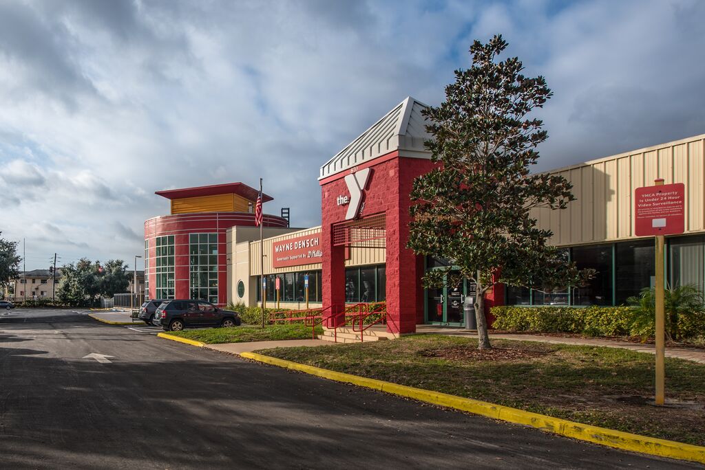 Location photo of the Wayne Densch YMCA family center building with clear blue skies