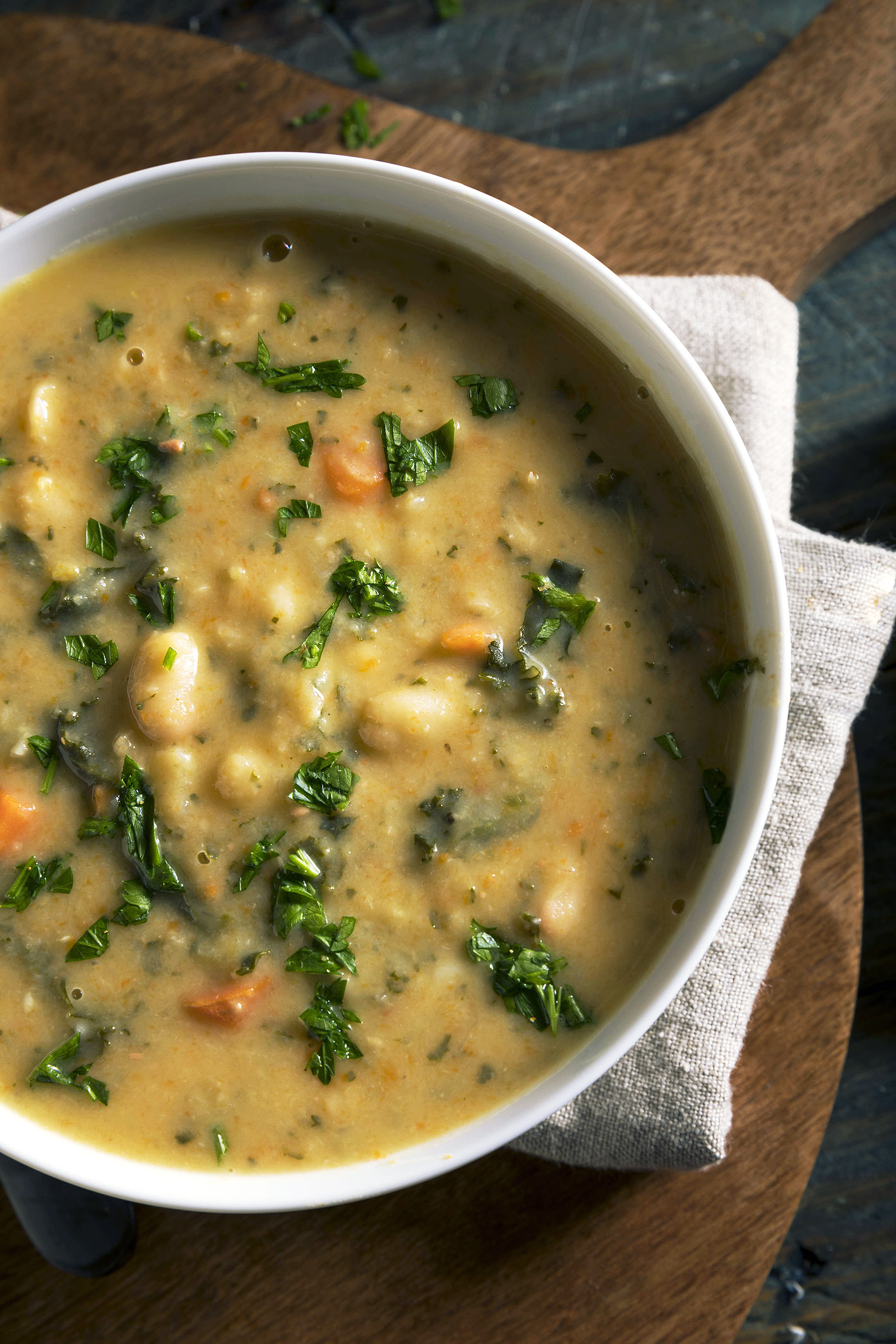 A photo of white bean soup with super greens