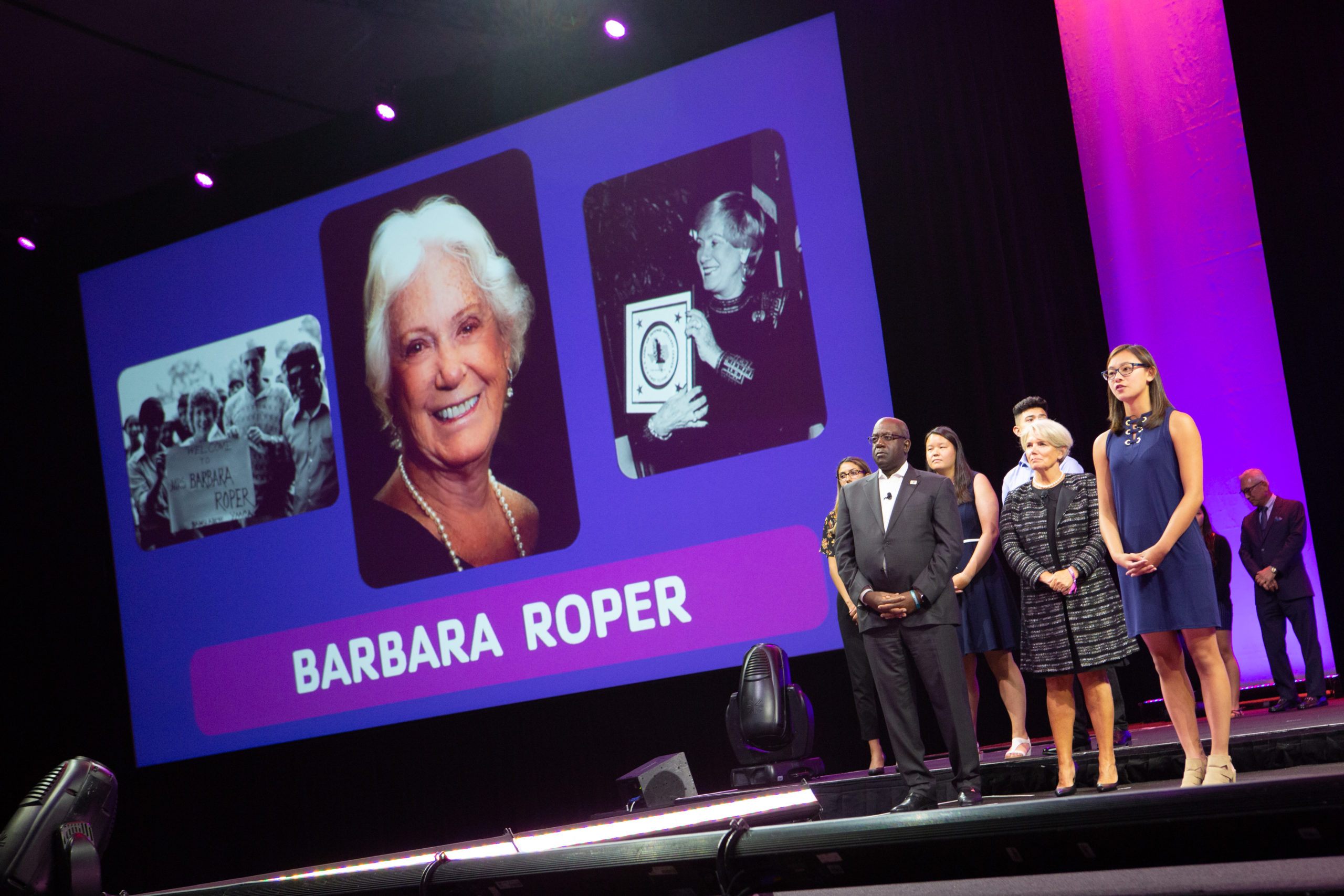 Barbara Roper being honored at the YMCA general session on stage with other Y employees