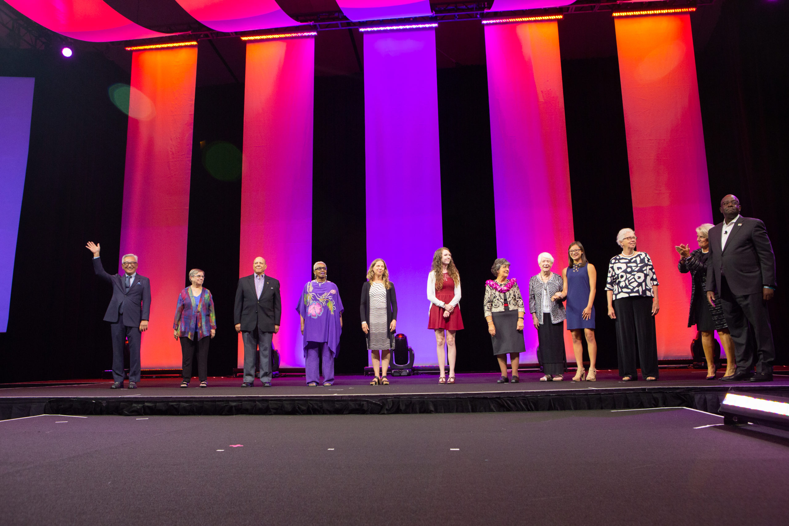Barbara Roper being honored at the YMCA general session on stage with other Y employees