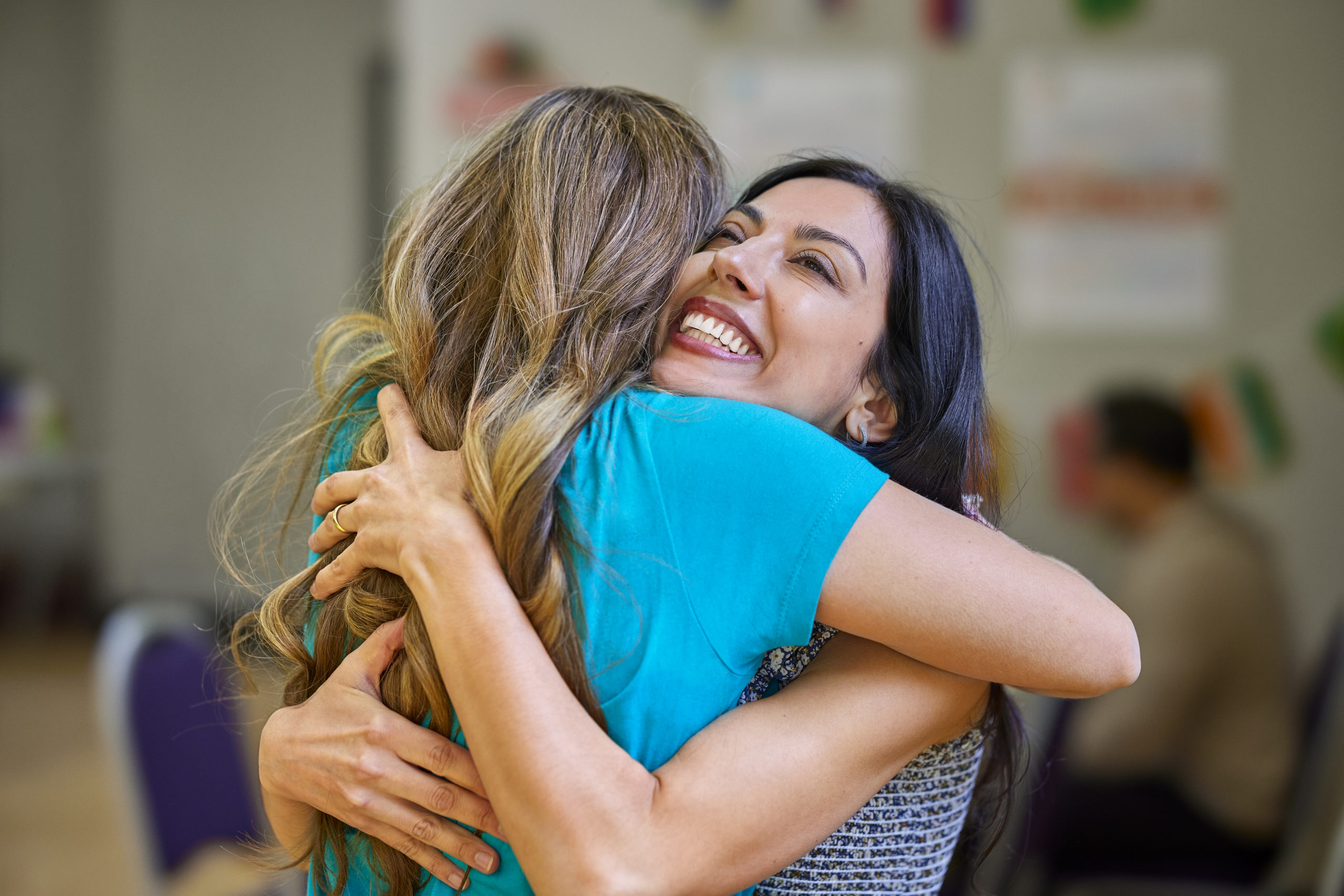 Women embracing in friendly hug