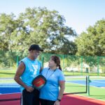 Couple on the pickleball court at Frank DeLuca YMCA in Ocala