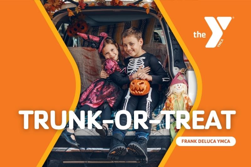 Kids dressed in Halloween costume sitting in back of an open hatchback