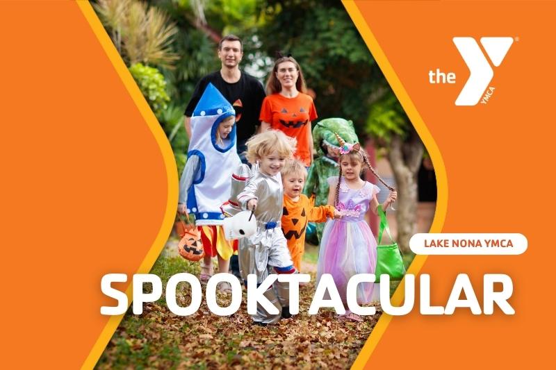 Kids dressed up for Trick-or-Treating with parents following behind them