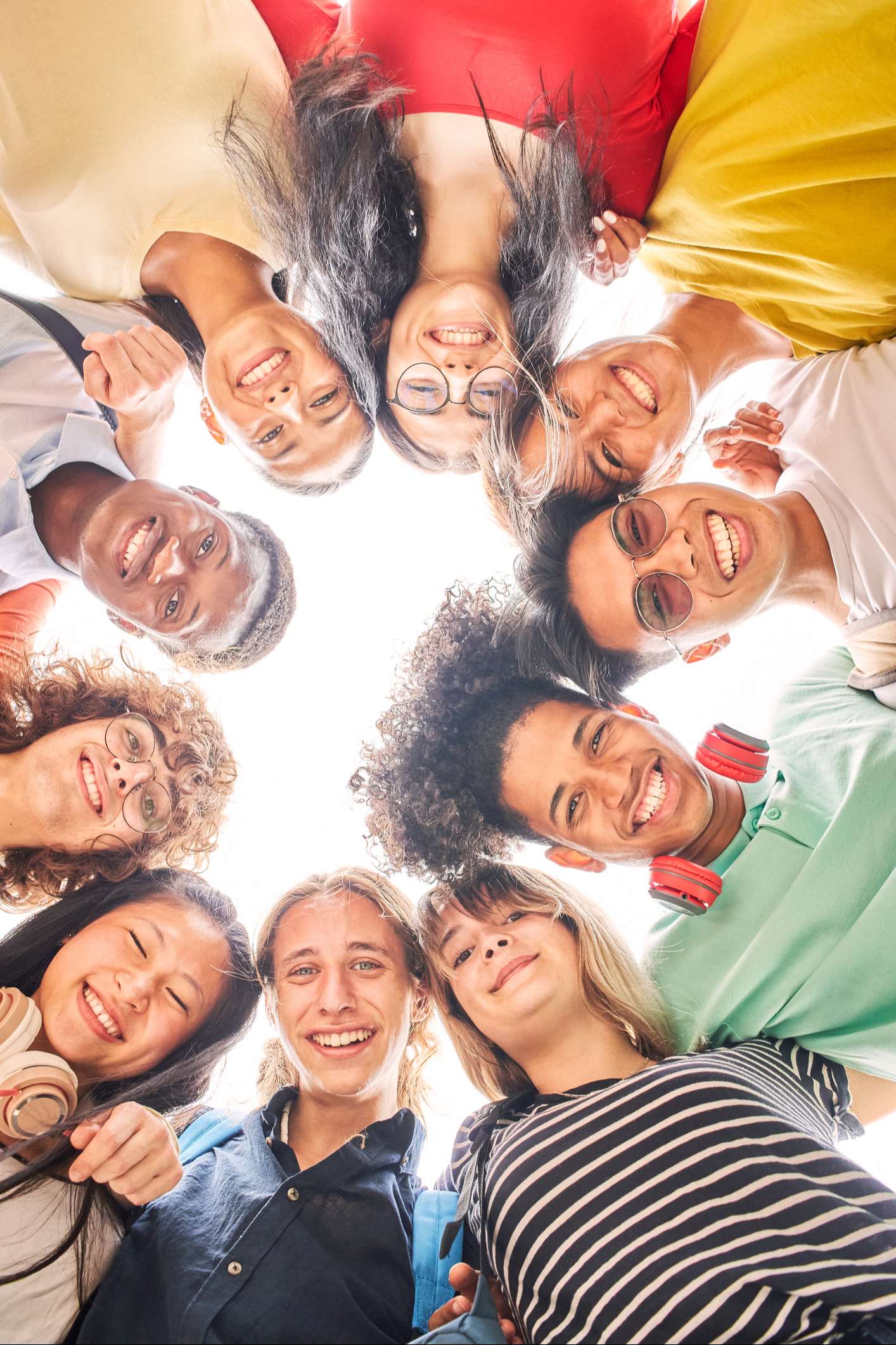 Group of smiling teens in a circle