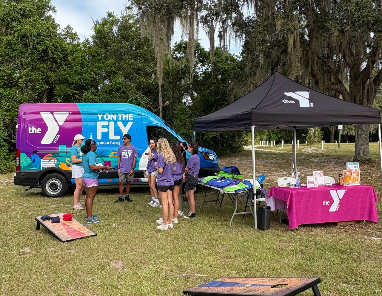 YMCA's Y on the Fly van and team preparing at an outdoor Girl Scouts event