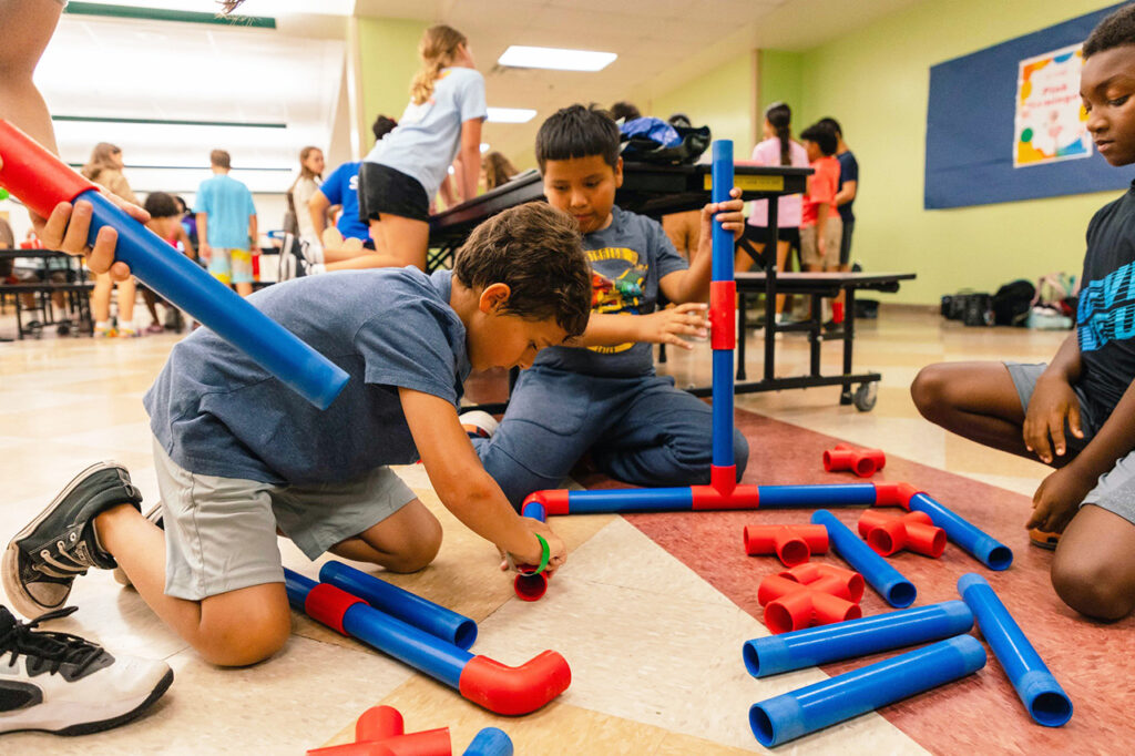 Group of boys building a STEM project during their After School Club at Lake Nona YMCA